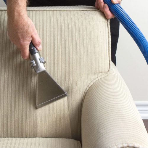 Vacuuming A Cream Couch